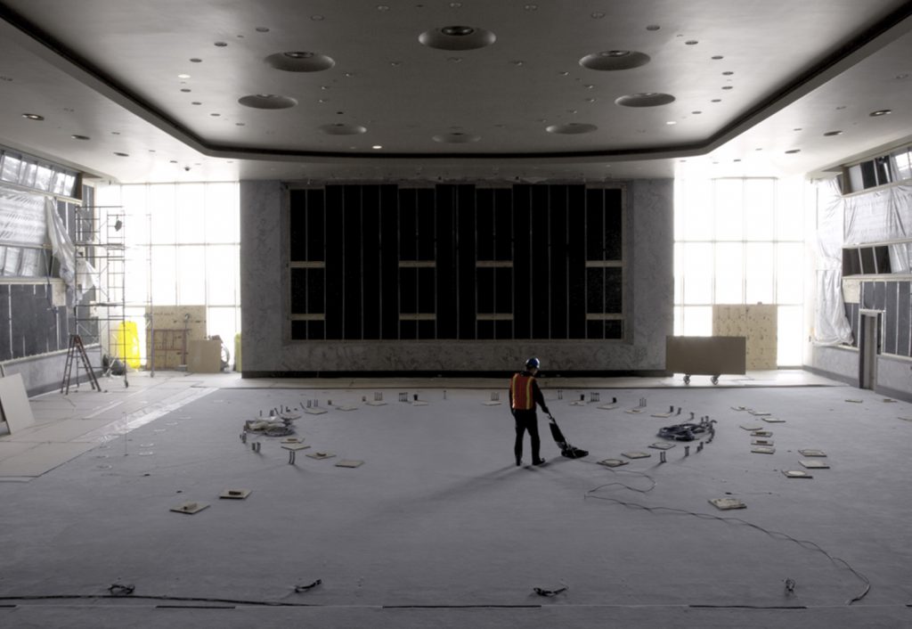 Man vacuuming during renovation of Security Council Chamber, UN Headquarters New York, 2017