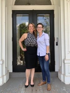 Kristen Syrett and Meg Gotowski standing in front of the Linguistics Department