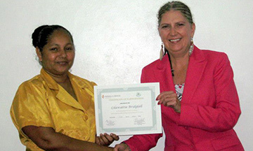 Lilawattie "Ana" Bridglall receiving certificate from Dr. Brumfield in Georgetown, Guyana 