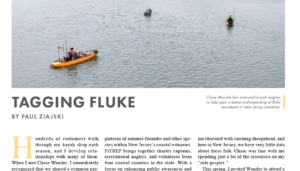 Three people on water in kayaks fishing