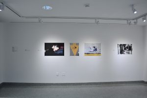 Installation view of four photographs.