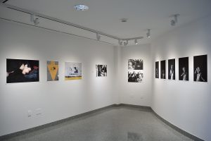 Installation view of eleven photographs.