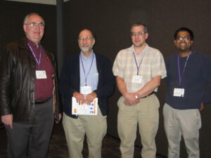 From left to right: Dana Scott, his "child" Fred Roberts, his "child" Garth Isaak, and his "child Darren Narayan", Phoenix, AZ, January 2004