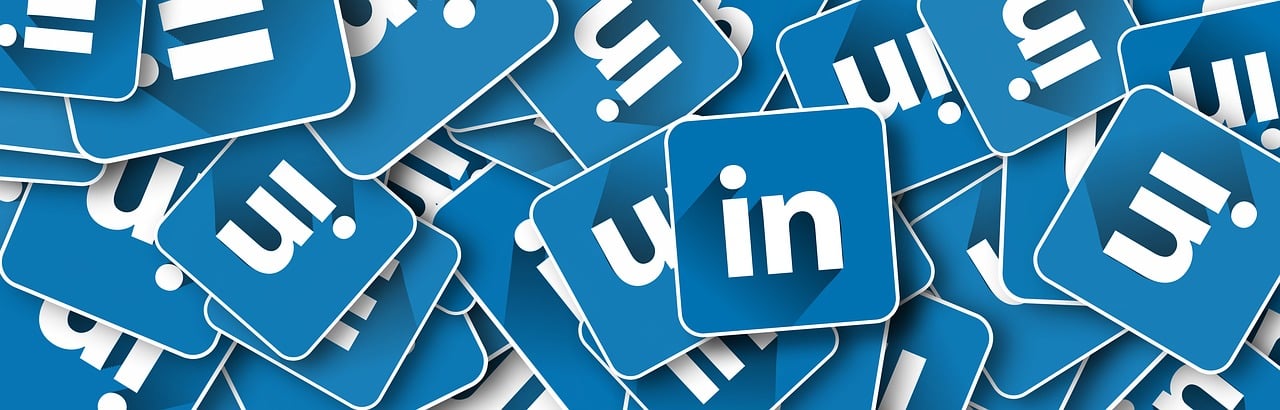 Several blue and white LinkedIn logos
