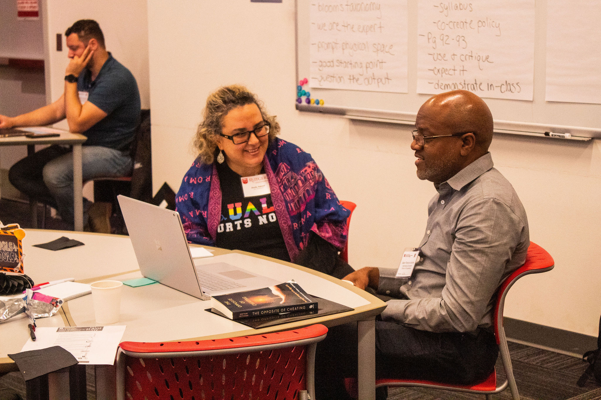 Two May 2025 Course Design Institute participants collaborating during the workshop.