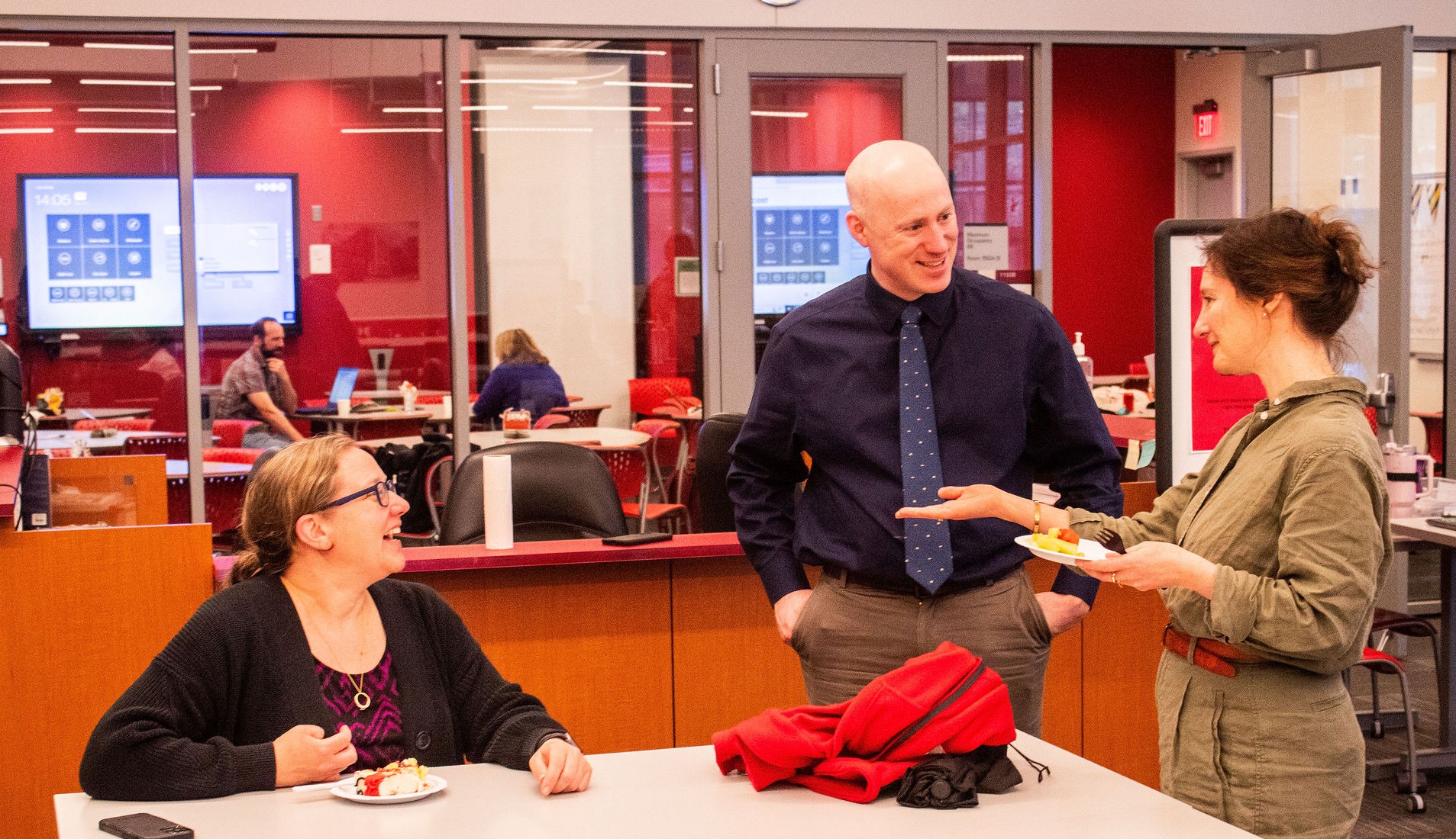 This photo shows three participants chatting.