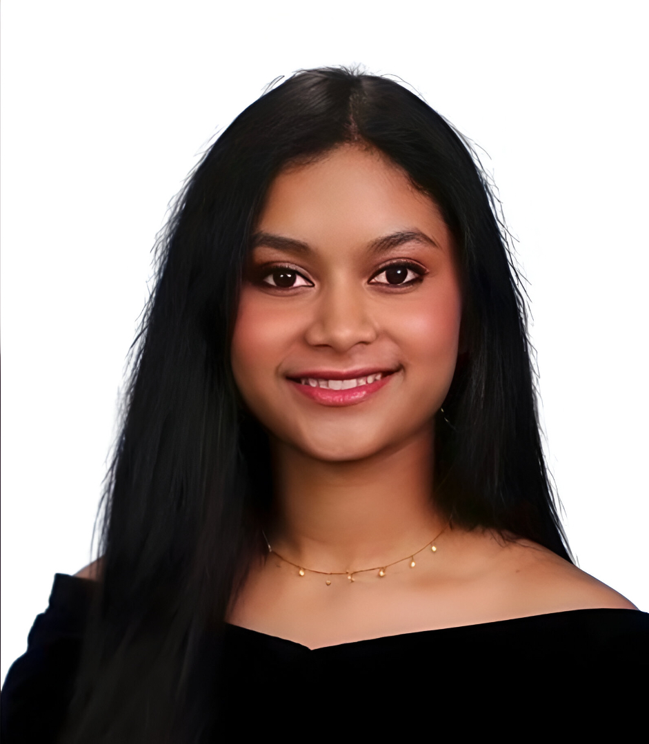 A headshot of a student with brown hair, wearing a black shirt, against a solid white background.