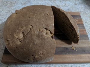 Baked bread with a slice missing