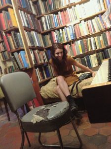 Tatevik sitting in a library