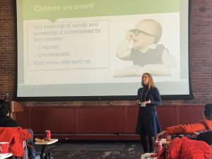 Kristen in front of powerpoint