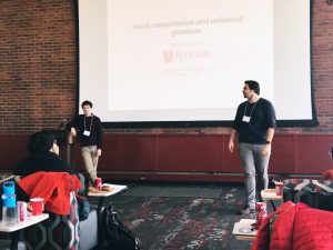 Troy and Adam in front of powerpoint