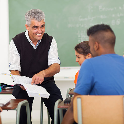 high school teacher with students