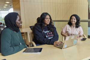 Three students working together.