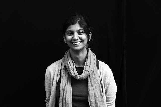 Headshot of Jayati Narain stading in front of black background
