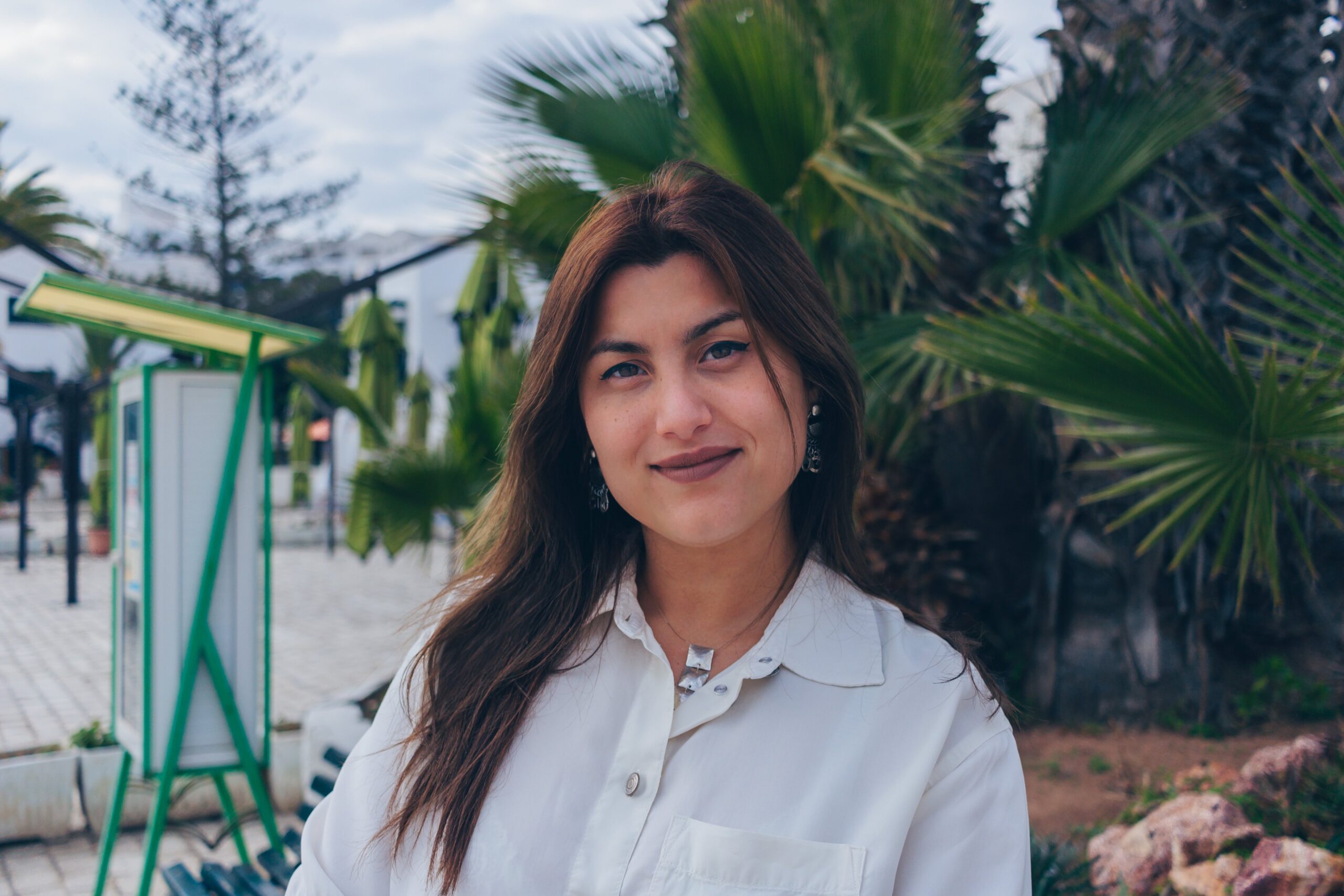 Headshot of Roula Seghaier with a park in the background.