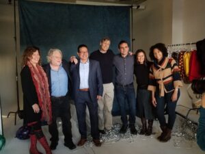 Group shot of faculty members in a photo studio