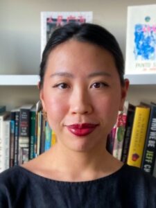 Headshot of Diane Wong with books and art prints in the background.