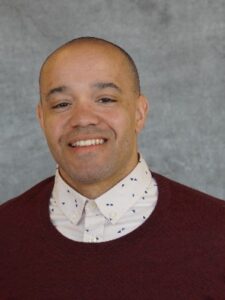 Headshot of Wendell Marsh in a burgundy sweater