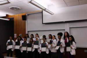 2019 Pre-Junior Clinical Scholars receiving certificates of completion at the Rites of Passage Ceremony