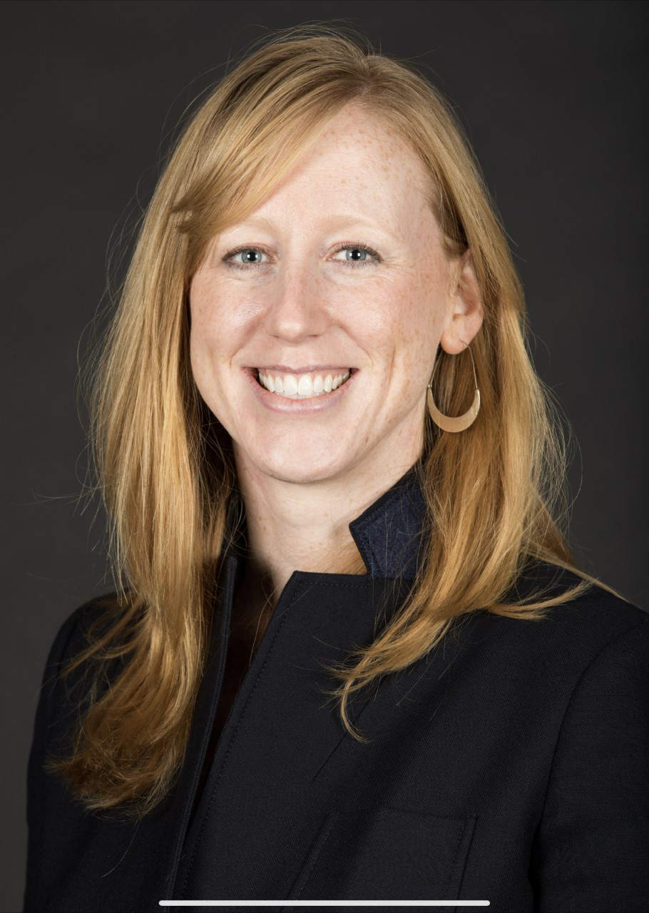 headshot of Lauren Challish in a black blazer faced forward with a smile
